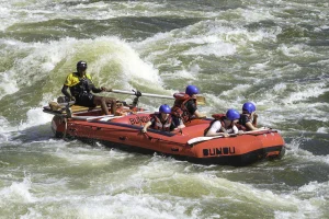 Rafters running a rapid on the Zambezi River in the Batoka Gorge, Zambia
